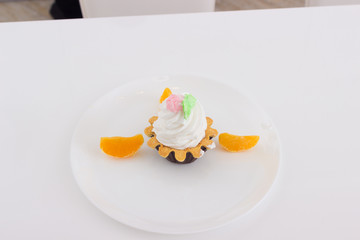 cake basket with cream on a plate
