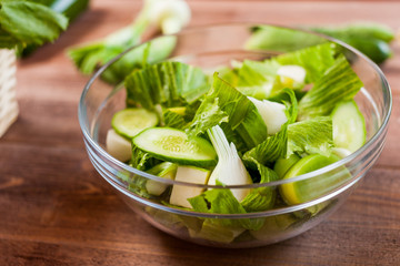 vegetable green salad bowl on kitchen table, balanced diet