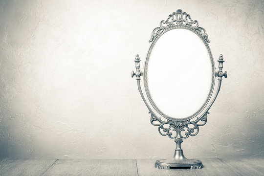 Retro old desk mirror frame. Vintage style sepia photo