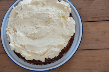 Homemade cake with carrot, cheese and cream