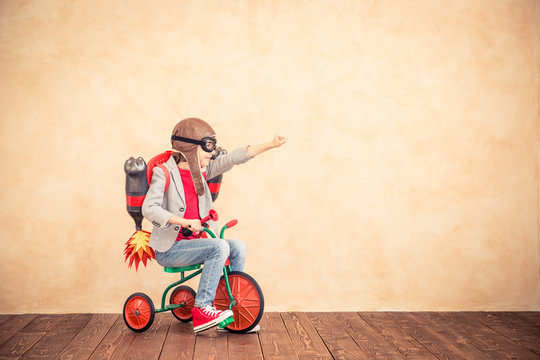 Kid with jet pack playing at home