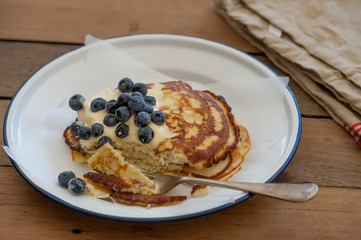 Coconut pancake served with blueberries