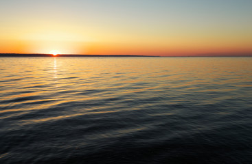 Obraz premium Beautiful sunset over the ocean. Sunrise in the sea