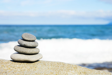 Fototapeta na wymiar concept of balance and harmony. rocks on the coast of the Sea