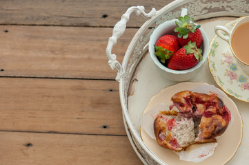 Breakfast with strawberries and muffins