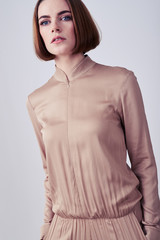 Nice model posing in beige overalls