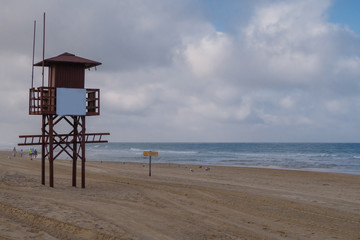 Position of the beach guard at La Barrosa beach in Sancti Petri, seen from the cliffs of Chiclana