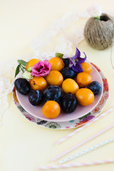 fruit and flowers on a yellow background