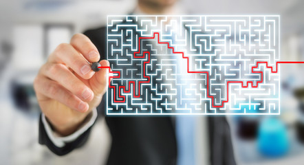 Businessman searching solution of a complicated maze
