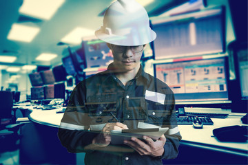 Double exposure of  Engineer or Technician man in working shirt  working with tablet in control room of oil and gas platform or plant industrial for monitor process, business and industry concept