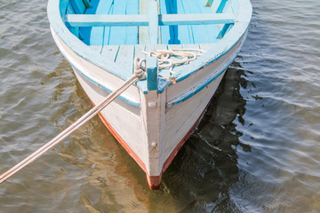 Obraz premium Prow of a wooden fishing boat on the deck in harbour, Adriatic sea, Croatia