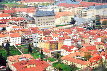 Aerial panoramic view of the historic center of Prague, Czech Republic. Red tiled roofs and colorful facades of landmarks.