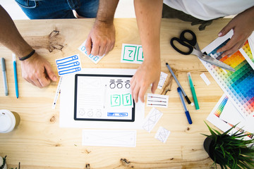 hands designing tablet screen