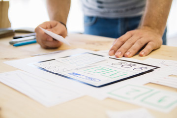 hands planning a website wireframe