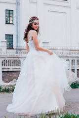 Fototapeta premium Beautiful bride in a light and airy wedding dress