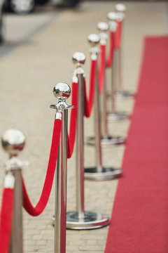 Red carpet leads to the building