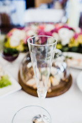 Empty champagne flute stands on the table