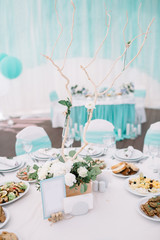 Bouquet of roses decorated with wicker stands on the table