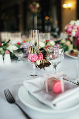 Box with macaroons stands on a dinner plate