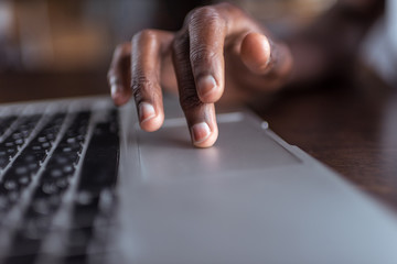 afro man using laptop