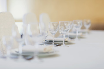 Sparkling wineglasses stand on a table