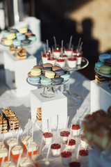 Macaroons and other desserts served on the table