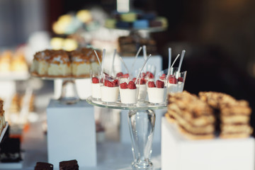 Macaroons and other desserts served on the table