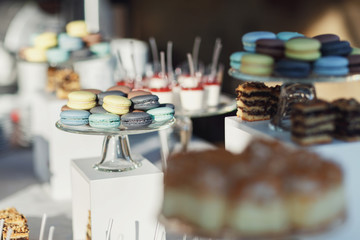 Macaroons and other desserts served on the table
