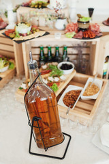 Bottle of whisky stands on a table