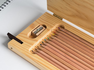 Wooden box of colored pencils