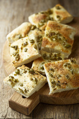Homemade bread with olives, herbs and olive oil