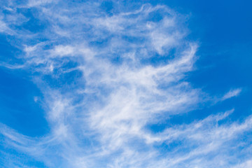 White clouds against blue sky as background