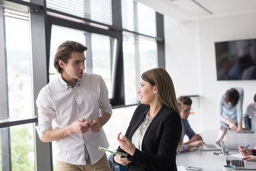 Two Business People Working With Tablet in office