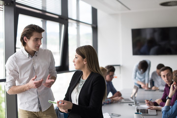 Two Business People Working With Tablet in office