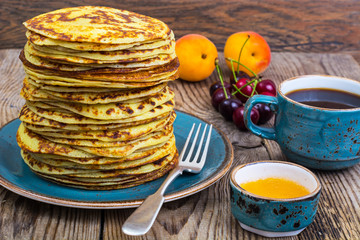 High stack of pancakes in rustic style