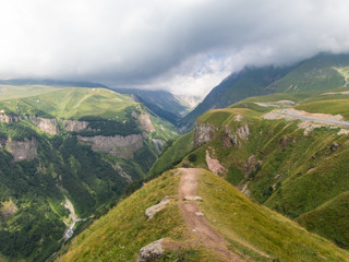 Fototapeta premium Beautiful green mountains in the clouds