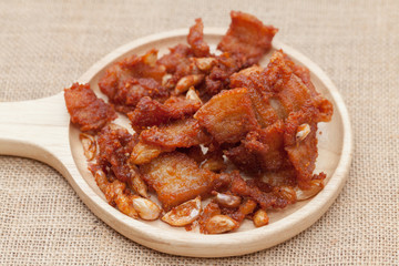 Fried Pork with Garlic Pepper on wooden plate