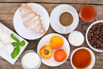 Breakfast table setting with  chocolate flakes, mozzarella,  jui