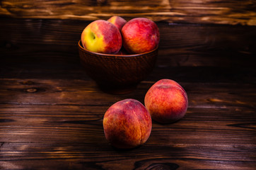 Fresh ripe peaches on wooden table