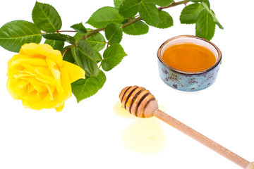 Honey of rose petals on white background