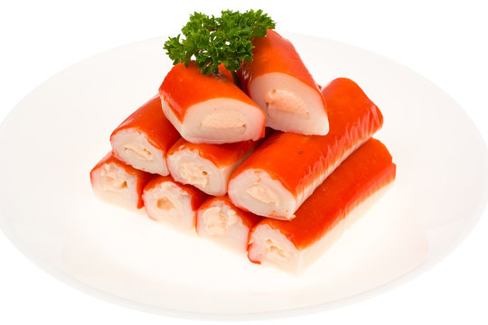 Crab sticks surimi stuffed with cheese on white background