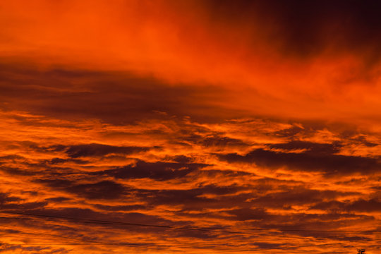 Red voluminous clouds at sunrise