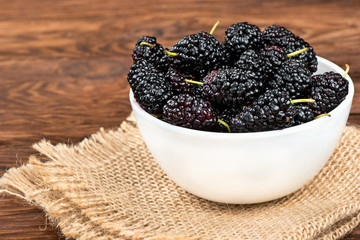 Black mulberries in bowl