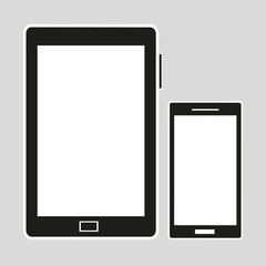 Computer and mobile phone on a gray background