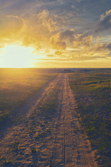Road to sunset on the Baltic Sea in summer