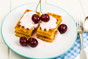 Sweet waffles with yoghurt and cherry