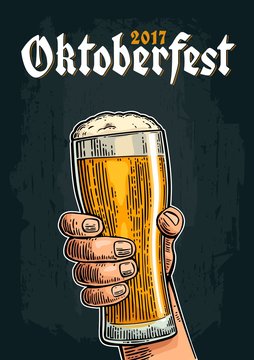 Male hand holding a beer glass. Vintage vector engraving illustration for web, poster, invitation to oktoberfest festival.