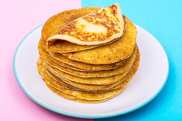 Pancakes on bright pastel color