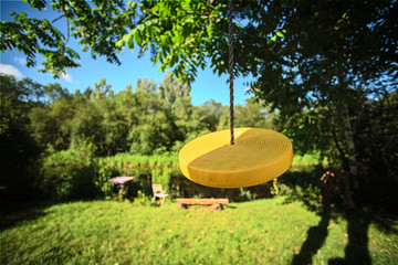 Yellow bungee swings for children on nature