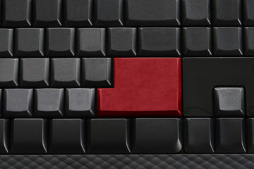 Keypad of black keyboard and have red enter button.